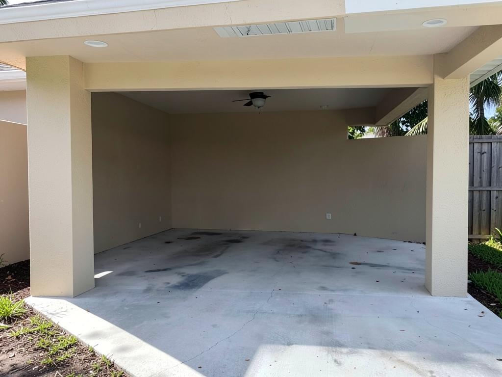 Empty covered carport parking space before installation